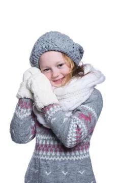 Happy cute kid posing in the studio isolated on white background. Wearing win Stock Photos