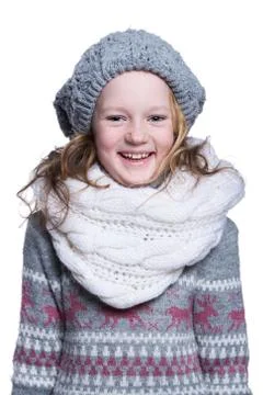 Happy cute kid posing in the studio isolated on white background. Wearing win Stock Photos