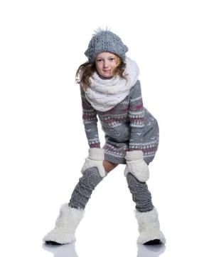 Happy cute kid posing in the studio isolated on white background. Wearing win Stock Photos