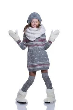Happy cute kid posing in the studio isolated on white background. Wearing win Stock Photos