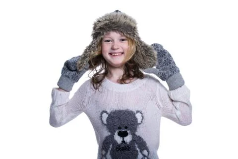 Happy cute kid posing in the studio. Wearing winter clothes. Knitted woolen s Foto stock