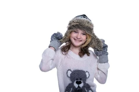 Happy cute kid posing in the studio. Wearing winter clothes. Knitted woolen s Foto stock