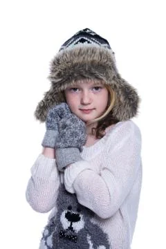 Happy cute kid posing in the studio. Wearing winter clothes. Knitted woolen s Stock Photos