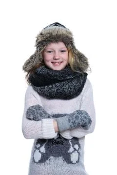 Happy cute kid posing in the studio. Wearing winter clothes. Knitted woolen s Stock Photos