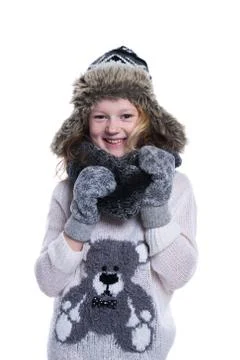 Happy cute kid posing in the studio. Wearing winter clothes. Knitted woolen s Stock Photos