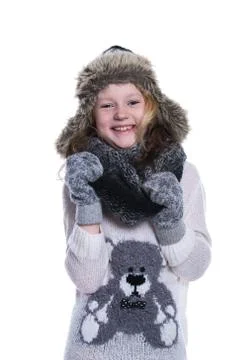 Happy cute kid posing in the studio. Wearing winter clothes. Knitted woolen s Stock Photos
