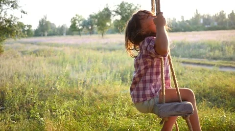 Happy cute little child girl have fun sw... | Stock Video - Pond5