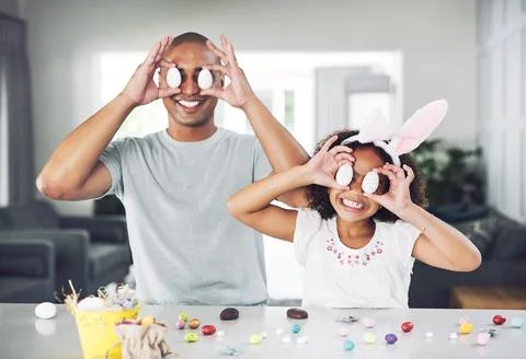 Happy, dad and child with easter eggs in home, color and preparing for fest.. Stock Photos