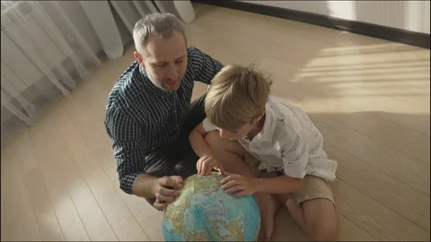Happy dad and small kid boy looking at globe, Stock-Footage 157600937