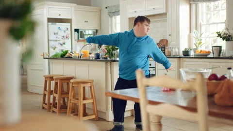 Happy, dance and man with down syndrome, energy and listening to music on Stock Footage 335801786