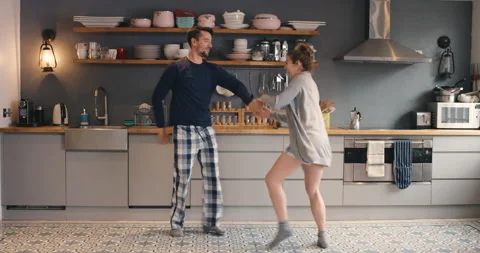 Happy, dance or couple in kitchen dancing in morning for freedom, fun or Vídeo Stock 223355911