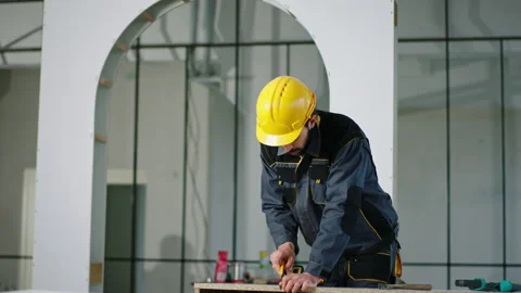 Happy dancing constructor worker man charismatic working at the plan of building Vídeos de archivo 232589760
