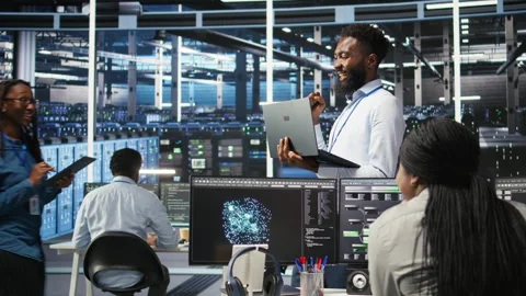 Happy data center admin using node tree tool doing high five with coworker Stock Footage 307013855