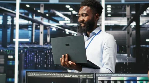 Happy data center admin using node tree tool doing high five with coworker Stock Footage 309113217
