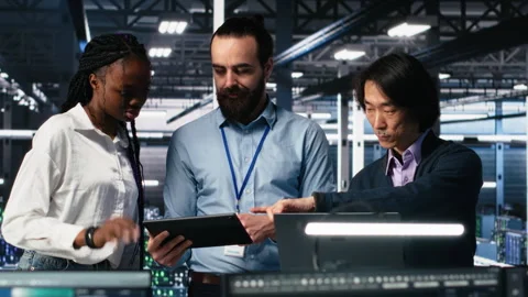 Happy data center colleagues collaborating on software development Stock Footage 313566865