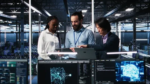 Happy data center colleagues collaborating on software development Stock Footage 313637239
