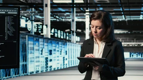 Happy data center female engineer inspecting blue wireframe mesh rigs, VFX Stock Footage 329334244