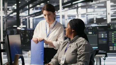 Happy data center manager pleased by work done by team integrating AI Stock Footage 309639124