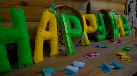 Happy Day from felt letters on fireplace Stock Footage