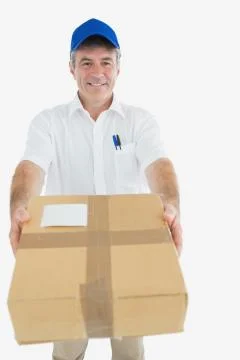 Happy delivery man giving package Stock Photos