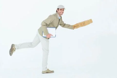 Happy delivery man running while holding parcel Stock Photos