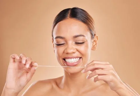 Happy, dental floss and woman in studio for teeth, cleaning and oral hygiene Stock Photos