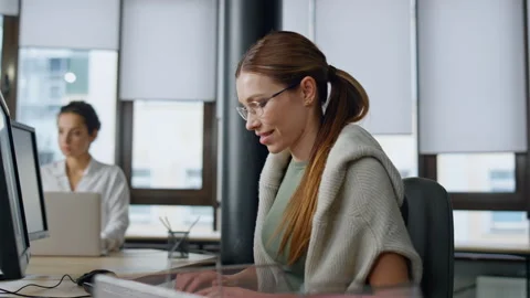 Happy developer typing computer in startup company. Smiling woman coder working Stock Footage 242983055