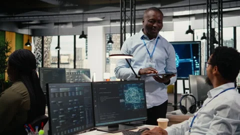 Happy developers chat in AI startup office, training predictive models Stock Footage 323143887