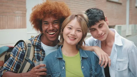 Happy diverse friends looking at the camera with smile, camera moved closer Stock Footage 252505221