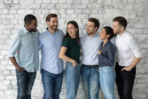 Happy diverse interns or newcomer employees celebrating getting hired Stock Photos