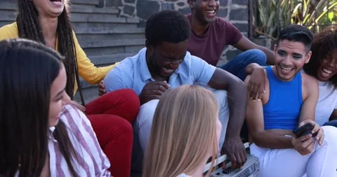 Happy diverse people using mobile phones while having fun together outdoor Stock Footage 158222696