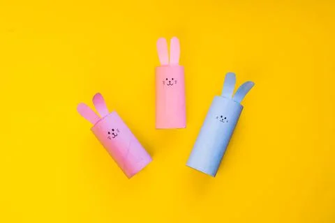 Happy DIY Easter decoration concept bunnies from toilet paper roll tube Photos