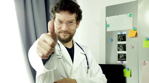 Happy doctor standing looking camera thumb up Stock Footage 48130651