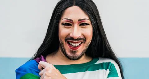 Happy drag queen activist having fun during gay pride parade Stock Photos