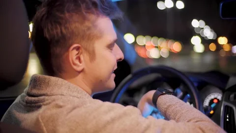 Happy driver using smartwatch in a car for handsfree voice recorder recognition Stock Footage 143858483