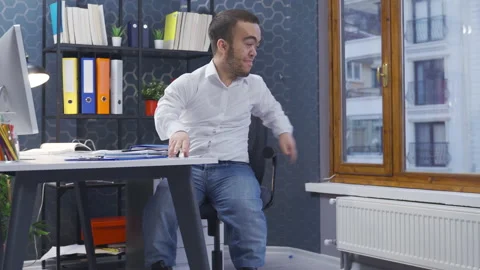 Happy dwarf man in the office. 動画素材 230978051