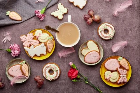 Happy Easter aesthetic coffee time flat lay. Decorated glazed cookies, coffee Stock Photos