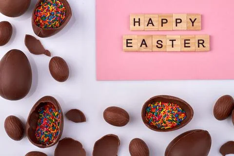 Happy easter and chocolate eggs. Stock Photos