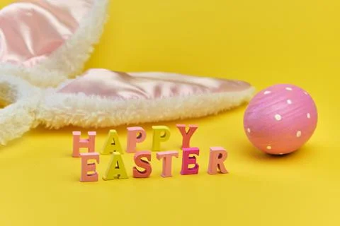 Happy Easter background, creative greetings. Lettering from wooden letters Stock Photos