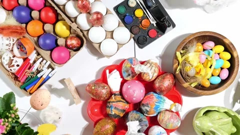 Happy Easter beautiful holiday table with Easter eggs, candies, paints Stock Footage 163982788