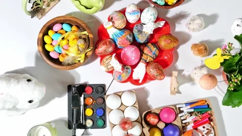 Happy easter beautiful holiday table with Easter eggs, candies, paints Stock Footage 163982833