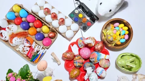Happy easter beautiful holiday table with Easter eggs, candies, paints Stock Footage 163982846
