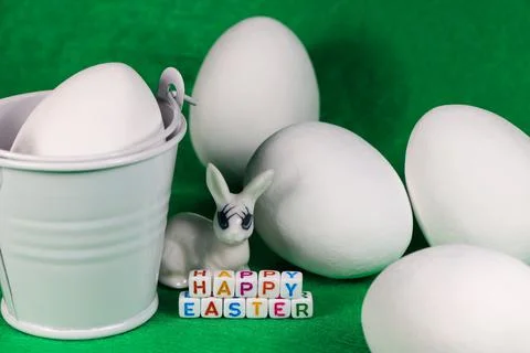 Happy Easter Bunny With Large White Eggs And Bucket Stock-Fotos