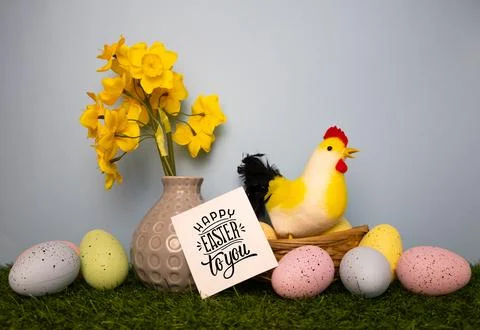 Happy Easter card with yellow spring flowers chicken colorful eggs Stock Photos