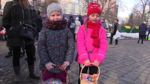 Happy Easter children show eggs and cake church celebration Stock Footage 88241213