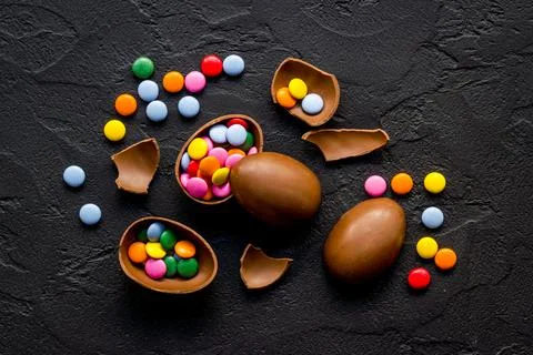 Happy Easter with chocolate eggs and sweets, top view Stock Photos