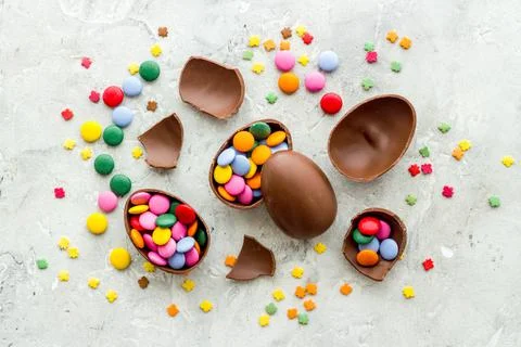 Happy Easter with chocolate eggs and sweets, top view Stock Photos