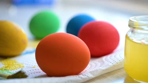 Happy easter. Close up of bright colored easter eggs on the table Stock Footage 124668677
