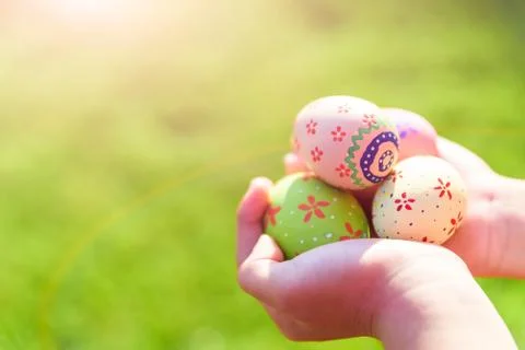 Happy easter! Close up of little kid holding colorful Easter egg Stock Photos