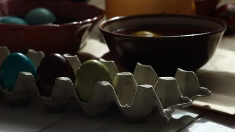 Happy easter. Colored easter eggs on the table. Dark home light Stock Footage 125437376